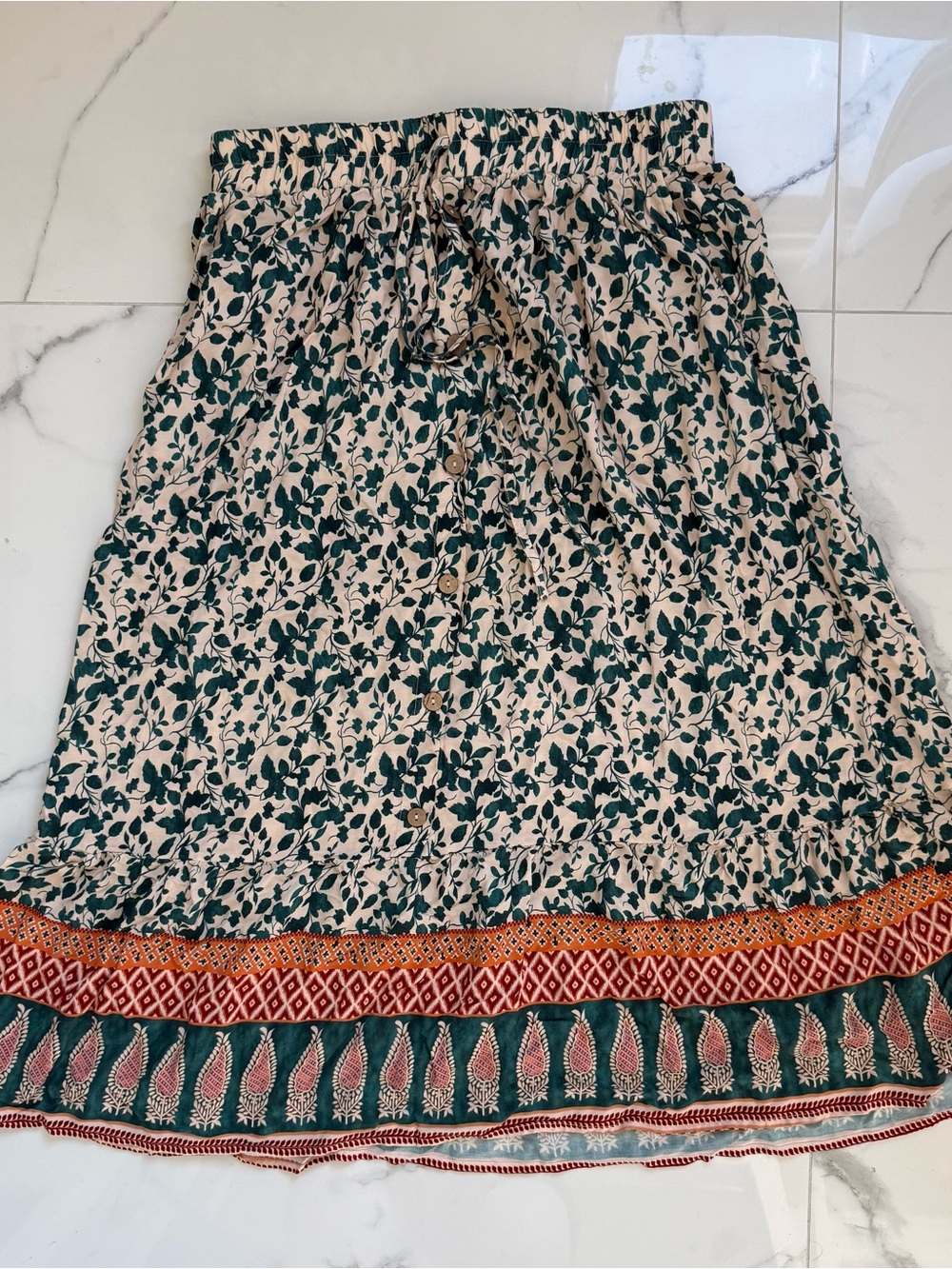 BloomChic Beige Midi Skirt with Green Floral Print and Multicolor Hem